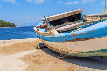 Obraz premium Old blue wooden shabby fishing boat