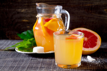 Drink fresh grapefruit on a wooden table