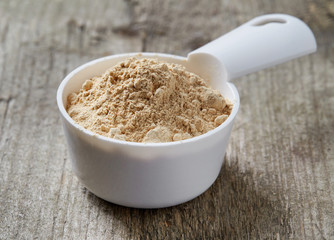 Measuring scoop of maca powder