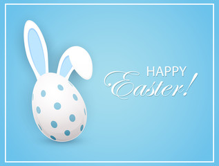 Easter egg with rabbit ears on blue background