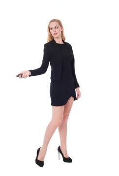 Full length portrait of an attractive professional woman wearing black dress suite and heels, isolated on a white background.
