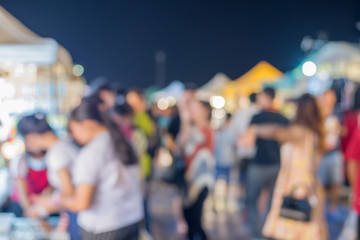 blur background of Crowd at night market 