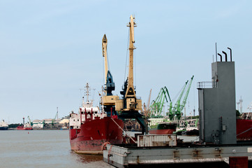 Port crane on blue sky