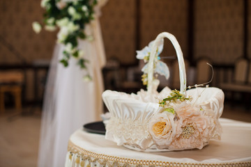 stylish decorated basket for greetings at the reception in a res
