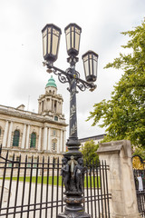 Fototapeta premium Old-fashioned street lamp against the building. Belfast, Northern Ireland