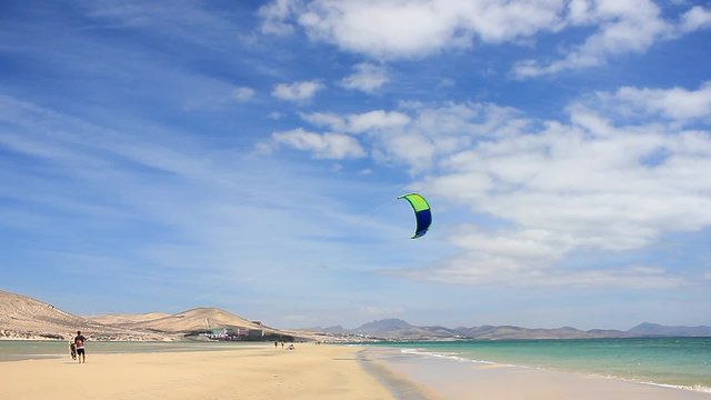 Kitesurfer walk on a beach with Softkite on Fuerteventura Canary Islands