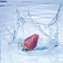 strawberry splashing into water
