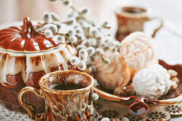 cups of coffee with a pussy willow, candies and a zephyr