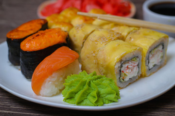 Japanese food seafood sushi , roll and chopstick on a white plate