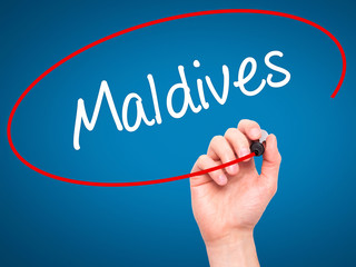 Man Hand writing Maldives  with black marker on visual screen