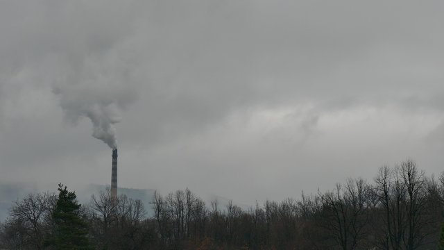 Chimney thermal power plant running on coal pollutes the air.