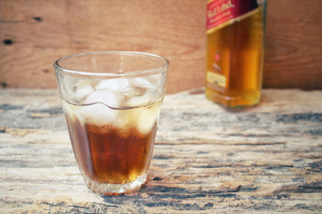 Glass of whiskey with ice