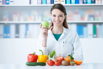 Smiling nutritionist in her office