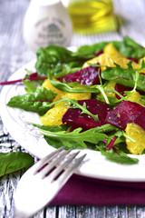 Fresh salad from greens,beetroot and orange.