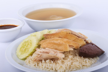Hainanese chicken rice, steamed chicken, chicken blood and white rice on white background.