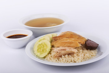 Hainanese chicken rice, steamed chicken, chicken blood and white rice on white background.