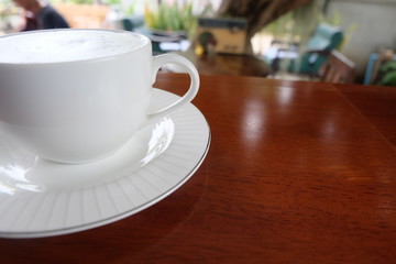 hot milk in white cup on table
