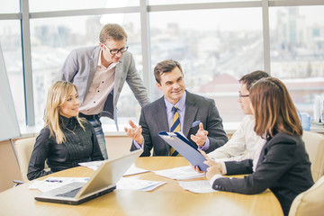 several businesspeople interacting at meeting