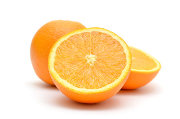 Whole and sliced orange on white background