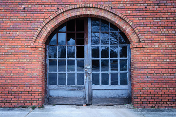 Fototapeta na wymiar Old Abandoned Building With Weathered Door