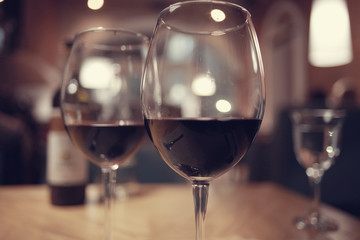 glass of wine, a restaurant serving a blurred background