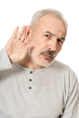 Obraz premium Man holds his hand near his ear and listening something