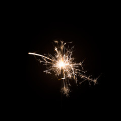 Sparkler little firework on black background. Use for Christmas