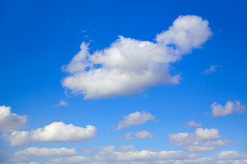 Naklejka na ściany i meble Blue sky with clouds in a sunny day