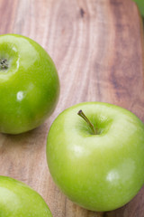 apples on a wooden board, top view, horizontal layout. fruit color image with space for writing