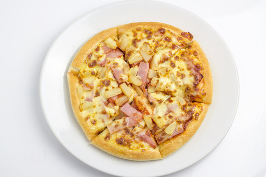 full pizza in white plate