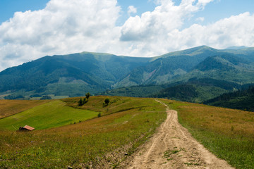 Dirt road against the landscape in the Ukrainian Carpathians