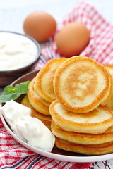 Obraz na płótnie Canvas Pancakes with sour cream