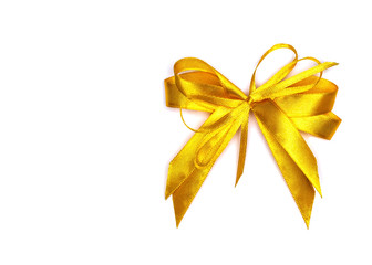 Golden satin gift bow. Ribbon. Isolated on white