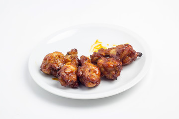 chicken fried in white plate