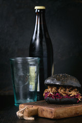 Black burger with dark beer