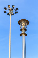 Fototapeta na wymiar Stainless steel lamp pole at the road on blue sky