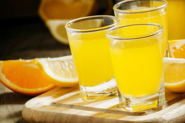 Beverage with orange and lemon juice and soda, selective focus