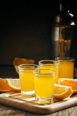 Beverage with orange and lemon juice and soda, selective focus