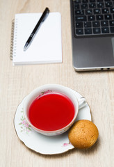 Cup of tea with cookie, tea break in office