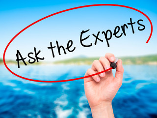 Man Hand writing Ask the Experts with black marker on visual scr