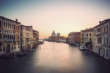 Obraz na płótnie Canvas long time exposure of canal grande in Venice (Venezia) - Santa Maria Della Salute, Church of Health in dusk twilight at Grand canal Venice, Italy, Europe, vintage filtered style 