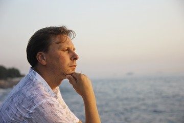 Handsome thoughtful man at the sea