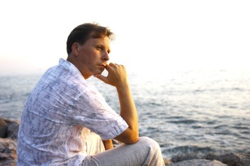 Handsome thoughtful man at the sea