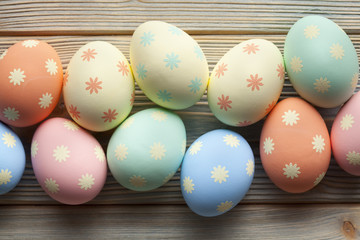 Colored Easter eggs on wooden planks