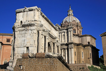Fototapeta na wymiar ROME, ITALY - DECEMBER 21, 2012: Arch of Septimius Severus and church of Santi Luca e Martina at the Roman Forum, Rome, Italy