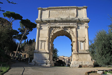 Fototapeta na wymiar ROME, ITALY - DECEMBER 21, 2012: Arch of Titus on Roman Forum in Rome, Italy