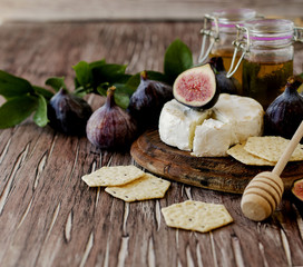 figs with cheese and honey , selective focus