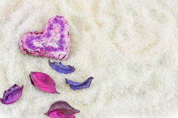 Heart shaped cookie and flower petals