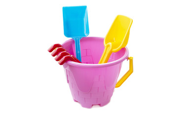 Toy plastic bucket with a shovel and a rake