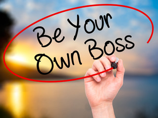Man Hand writing Be Your Own Boss with black marker on visual sc